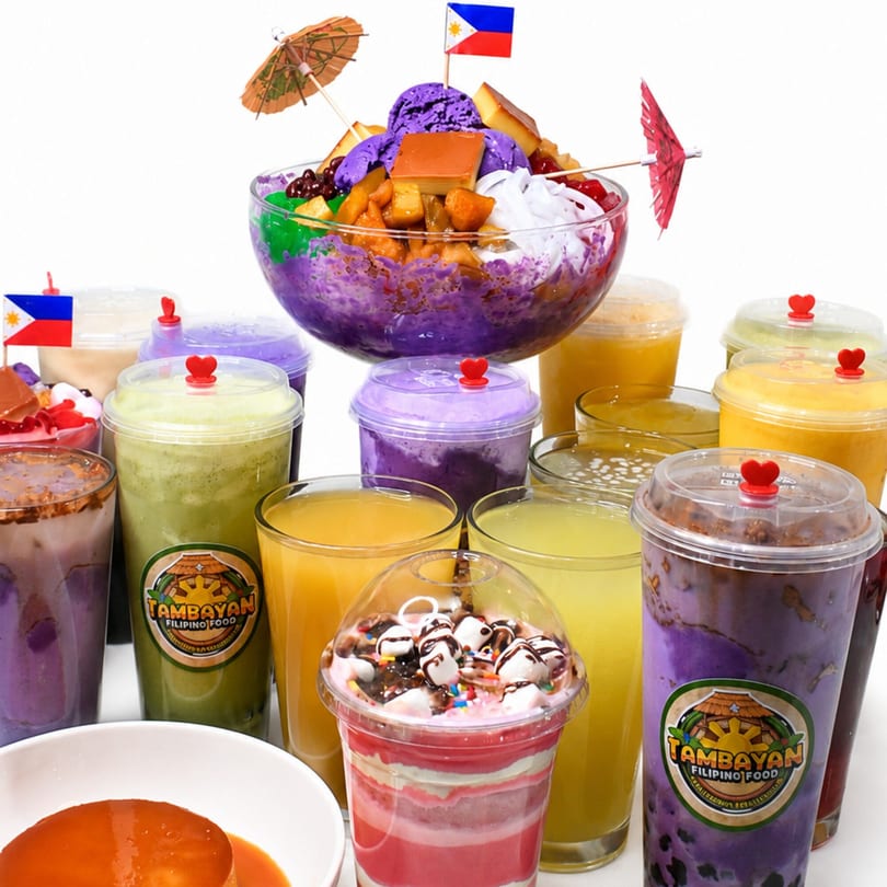 Halo-halo dessert with Filipino flag, surrounded by various Tambayan Filipino Food drinks and flan.